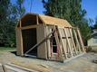 	Once the siding and roof sheathing was on, greenhouse framing could begin.  The shed and the greenhouse are actually separate structures, with the frame of the greenhouse nailed into the frame of the shed through the siding.  The greenhouse is almost freestanding on its own.
